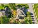 Sprawling home with landscaped backyard featuring mature trees and an outdoor patio at 404 Brookridge Dr, Mount Holly, NC 28120