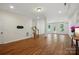 Finished basement with hardwood floors, staircase, and lots of natural light from outside at 404 Brookridge Dr, Mount Holly, NC 28120