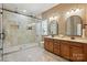 Primary bathroom with double vanity, walk-in shower, and tile flooring at 404 Brookridge Dr, Mount Holly, NC 28120