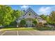 Attractive clubhouse with large windows and architectural details, enhancing curb appeal and community amenities at 404 Brookridge Dr, Mount Holly, NC 28120