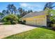 Long driveway leads to the three-car garage of the exterior elevation at 404 Brookridge Dr, Mount Holly, NC 28120