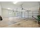 Spacious three-car garage with ample storage and lighting at 404 Brookridge Dr, Mount Holly, NC 28120