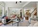 Open-concept living space showcasing elegant finishes and seamless flow to kitchen and dining areas at 404 Brookridge Dr, Mount Holly, NC 28120