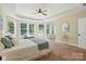 Spacious main bedroom with lots of natural light and a tray ceiling with a ceiling fan at 404 Brookridge Dr, Mount Holly, NC 28120