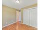 Bedroom featuring hardwood floors, closet, and neutral paint colors at 4143 Tullock Creek Dr, Charlotte, NC 28269