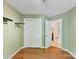 Bedroom featuring hardwood floors, a closet, and neutral paint colors at 4143 Tullock Creek Dr, Charlotte, NC 28269