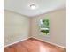 Bedroom with hardwood floors, a window view, and neutral paint colors at 4143 Tullock Creek Dr, Charlotte, NC 28269