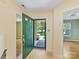Inviting entryway with a green front door and views of the living spaces at 4143 Tullock Creek Dr, Charlotte, NC 28269