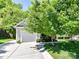 Inviting home exterior featuring a well-kept lawn and attached garage at 4143 Tullock Creek Dr, Charlotte, NC 28269