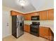 Bright kitchen with stainless steel appliances, light countertops and tile floors at 4143 Tullock Creek Dr, Charlotte, NC 28269