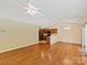 Bright living area showcasing hardwood floors and an open view to the kitchen at 4143 Tullock Creek Dr, Charlotte, NC 28269