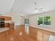 Open-concept living space featuring hardwood floors and modern kitchen view at 4143 Tullock Creek Dr, Charlotte, NC 28269
