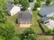 Aerial view showcasing the home, a spacious backyard with a wooden deck, and mature trees for privacy at 4219 Shasta Cir, Clover, SC 29710