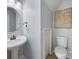 Charming powder room featuring a pedestal sink, round mirror, and convenient toilet placement for easy access at 4219 Shasta Cir, Clover, SC 29710