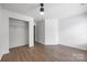 Large bedroom with hardwood floors, a ceiling fan, and a convenient closet for organized storage at 4219 Shasta Cir, Clover, SC 29710