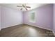 Bedroom with laminate flooring, large window, and a ceiling fan at 4219 Shasta Cir, Clover, SC 29710
