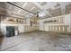 Spacious garage featuring ample storage shelves and a clean, organized layout at 4219 Shasta Cir, Clover, SC 29710