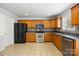 Traditional kitchen featuring wood cabinets, stainless steel appliances, and tile backsplash at 4219 Shasta Cir, Clover, SC 29710