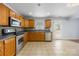 Well-lit kitchen featuring stainless steel appliances, wood cabinets, and tile flooring at 4219 Shasta Cir, Clover, SC 29710