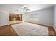Comfortable living area with a decorative rug, natural light, and an open view to the kitchen at 4219 Shasta Cir, Clover, SC 29710