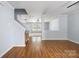 Spacious Living Room with laminate floors, stairs to the second floor, and a large window at 4219 Shasta Cir, Clover, SC 29710