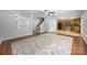 Open living space with hardwood flooring, views to the kitchen, and a cozy area rug at 4219 Shasta Cir, Clover, SC 29710
