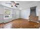 Inviting living room with hardwood floors, a window seat, and stylish staircase access at 4219 Shasta Cir, Clover, SC 29710