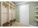 Mudroom with built-in shelving, bench, and coat hooks, perfect for storage at 4219 Shasta Cir, Clover, SC 29710