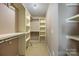 Spacious walk-in closet with carpet flooring, multiple shelves, and hanging rods for optimal organization at 4219 Shasta Cir, Clover, SC 29710