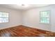 Bedroom featuring hardwood floors and natural lighting at 4925 Seacroft Rd, Charlotte, NC 28210