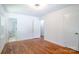 Bright bedroom with hardwood floors and ensuite bathroom at 4925 Seacroft Rd, Charlotte, NC 28210