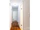 Hallway with hardwood floors and white trim at 4925 Seacroft Rd, Charlotte, NC 28210