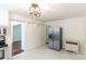 Open kitchen area with stainless steel refrigerator and modern appliances at 4925 Seacroft Rd, Charlotte, NC 28210