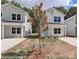 Charming two-story home featuring light-colored siding, double-hung windows, and a welcoming front porch at 556 Ridge Ave, Mooresville, NC 28115