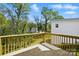 Enjoy the outdoor scenery from this home's wooden back deck with wooden railings at 74 Snyder Ne Ct, Concord, NC 28025