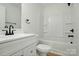 A full bathroom featuring a shower-tub combo and modern vanity at 74 Snyder Ne Ct, Concord, NC 28025