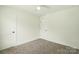 Bedroom with neutral carpeting and a double-door closet at 74 Snyder Ne Ct, Concord, NC 28025