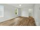 Bright bedroom with a ceiling fan, two windows and wood look floors at 74 Snyder Ne Ct, Concord, NC 28025