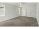 Bright, airy bedroom features soft carpet, large windows and white trim at 74 Snyder Ne Ct, Concord, NC 28025