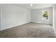 Spacious carpeted bedroom with large windows at 74 Snyder Ne Ct, Concord, NC 28025