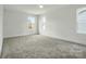 Bedroom with neutral carpet and multiple windows allowing for ample natural light at 74 Snyder Ne Ct, Concord, NC 28025