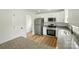 Bright kitchen featuring stainless steel appliances, granite countertops, and white cabinets at 74 Snyder Ne Ct, Concord, NC 28025