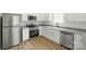 Modern kitchen with stainless appliances, white cabinets, and attractive countertops at 74 Snyder Ne Ct, Concord, NC 28025
