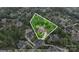 Beautiful aerial showcasing the property's location with lush trees, landscape, and nearby homes at 7600 Brookmont Ln, Waxhaw, NC 28173