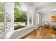 Backyard view from a large window with a swimming pool and lush green landscaping at 7600 Brookmont Ln, Waxhaw, NC 28173