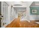 Grand foyer with hardwood floors, staircase, and a view into adjoining rooms at 7600 Brookmont Ln, Waxhaw, NC 28173