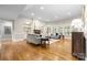 Bright and spacious living room with hardwood floors, fireplace, and ample natural light at 7600 Brookmont Ln, Waxhaw, NC 28173