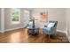 Bright living room with hardwood floors, light walls, a blue vase, and plenty of natural light at 7600 Brookmont Ln, Waxhaw, NC 28173