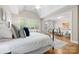 Spacious main bedroom with high ceilings, large windows, and an attached sitting room at 7600 Brookmont Ln, Waxhaw, NC 28173