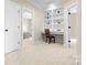Office space with built in shelving, off-white carpet, and trim at 7600 Brookmont Ln, Waxhaw, NC 28173